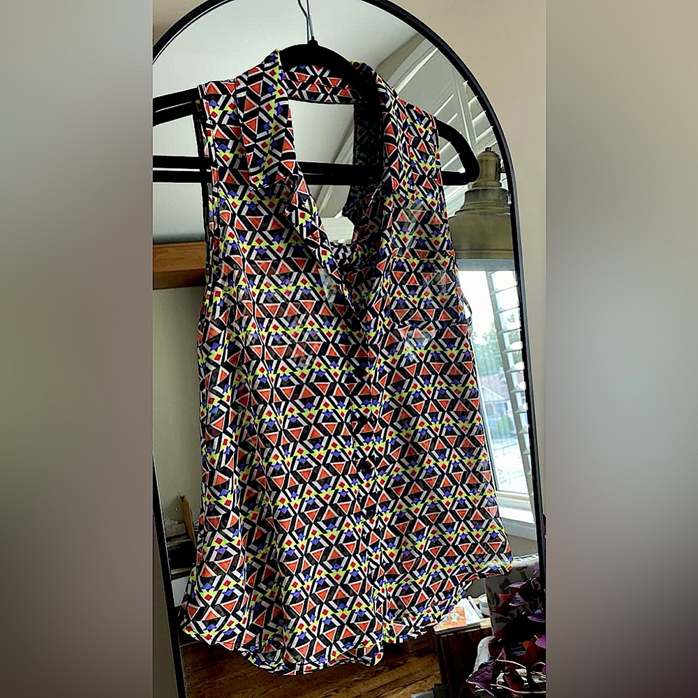 Medium-Large Material Girl cut-out sleeveless blouse.